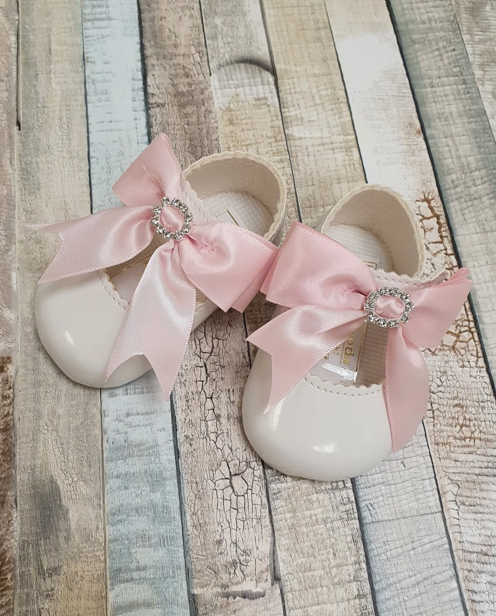 White Patent Soft Bottom Diamante Pram Shoe With Pink Ribbon Bow